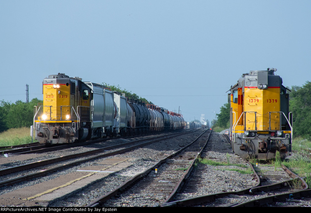 UP 1379 looks on as another train passes 